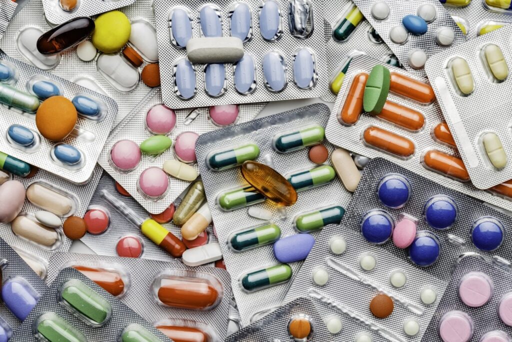 An assortment of colorful and different-shaped pills.